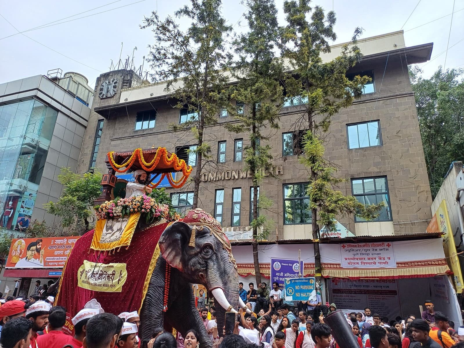 Visarjan procession float passing the Commonwealth building on Laxmi Road, Pune